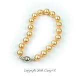 Single Strand 7-7.5 Inch 8MMGolden Shell Pearl Bracelet