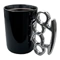 Thabto Schlagringtasse - schwarz mit silbernem Henkel