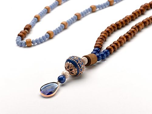 Long necklace designed with Czech beads, a Tibetan pead and goldfilled pendant. Brand new.