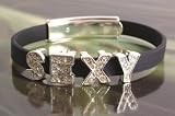 Image of Ladies fashion bling bracelet on pink or black soft plastic band - SEXY - advise colour choice at time of order