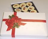 Scott's Cakes 1 lb. White Chocolate Almond Clusters in a Ribbon n Holly Box