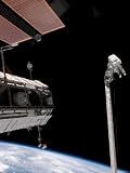 Astronauts Work in Tandem on the Shuttle's Remote Manipulator System/Orbiter Boom Sensor System Photographic Poster Print by Stocktrek Images, 9x12