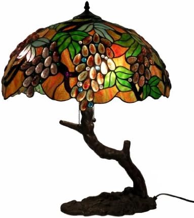 Tiffany Style Oval Grape Lamp In Tree Base Tiffany Style Oval Grape Lamp In Tree Base. The shade is made of individually cut glass and cabochons that is wrapped around with copper foil and soldered together. The product dimension is 25"H x 20"W. It requires 2x60watts bulb (not included). The base is made of white zinc metal in bronze finish.