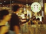 People at One of the First Starbucks Coffee Shops to Open in Beijing Premium Photographic Poster Print by Eightfish , 32x24