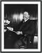 Historic Print (M): [John Bassett Moore, three-quarter length portrait, seated at desk, facing left]