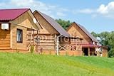 IMAGE OF Wallmonkeys Peel and Stick Wall Decals - The Wooden Houses with a Lawn on a Background of the Blue Sky - 48