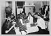 Family Sitting at Table Working with Garters 20x30 poster