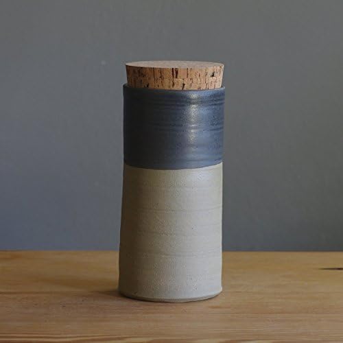black and sand colored stoneware jar