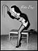 Betty Page Holding Whip Bettie Art Framed Poster Print - 24" X 36"