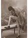 Young Woman Wearing a Fur Coat Cloche Hat and T-Bar Shoes Lifts Her Leg Up Costume & ...