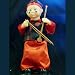 Musical Buddah Entertainer in Red