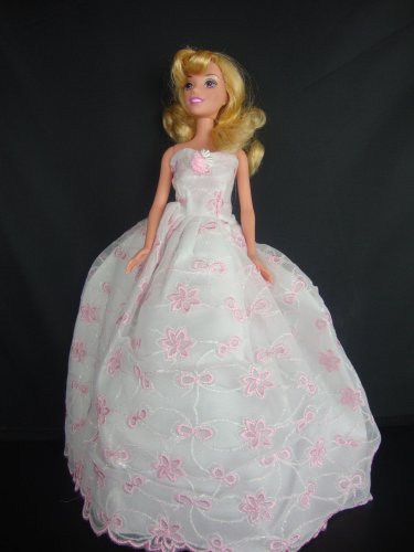 A White Strapless Ball Gown with Tiny Pink Flowers Made to Fit the Barbie Doll