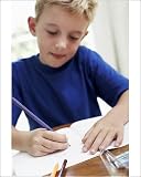 Photographic Print of Boy drawing in an exercise book from Science Photo Library