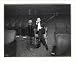 Historic Print (S): [Samuel L. Rothafel, full-length portrait, seated, in Capitol Theater, NYC, using Wester