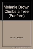 Melanie Brown climbs a tree