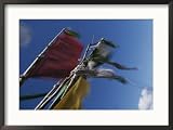 Prayer flags are ravaged by the wind in the Nyele La Pass, Bhutan Religion & Philosophy Framed Art Poster Print by Bobby Model, 29x21