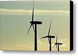 Silhouetted wind turbines against a cloudy sky Canvas Print / Canvas Art - Artist Sami Sarkis