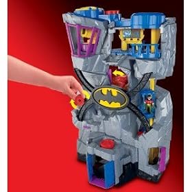 Imaginext Batcave with a Batman figure, a Robin figure, a batcycle, a bat-glider, a computer consol and two small accessories