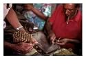 A Man Bundles up a Bunch of Finished Cigars in a Factory in Trinidad, Cuba, Trinidad, Cuba Photographic Print by Taylor S. Kennedy, 24" x 18"