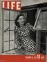 Muriel Stanhope, the pretty English wife of a U.S. fighter pilot who is now a German prisoner of war, was photographed in the window from which she used to watch for her husband to come home from his field after dangerous flights over the Continent. They lived in a small farmhouse near the field. ..... 1943 LIFE Magazine Cover, A0635 *** THIS IS A COVER ONLY / NOT A MAGAZINE ***