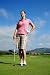 Young Woman Holding Golf Club on Green - 24