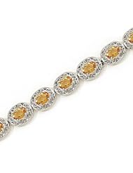 14kt Yellow Gold Oval Blue Topaz Bracelet.
