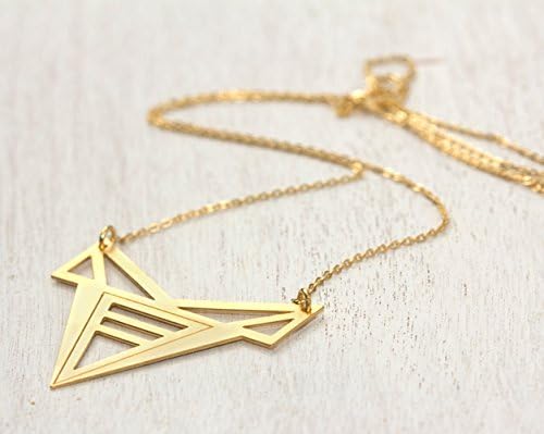 gold delicate Necklace, geometric transformers pendant on a dainty gold necklace.