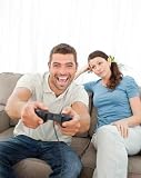 Bored Woman Looking at Her Boyfriend Playing Video Game on the S - 24