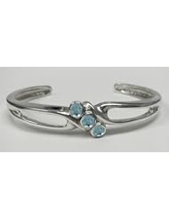A Large Sterling Silver 3 Stone Cuff Bracelet Accented with Genuine Faceted Blue Topaz