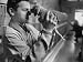 Attendant at the Michigan Humane Society Holding a Puppy Brought in For Adoption Photographic Poster Print by Paul Schutzer, 40x30
