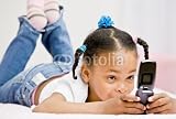 Wallmonkeys Peel and Stick Wall Decals - Happy Girl Text Messaging on Cell Phone in Bed in Bedroom - Removable Graphic