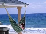 Woman Reading on a Hammock, Cayman Photographic Poster Print by Barry Winiker, 64x48