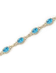 14kt Yellow Gold Oval Blue Topaz Bracelet.