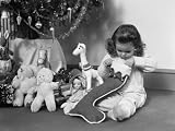 Young Girl in Pajamas - Opening Christmas Stocking Next To Christmas Tree Photographic Poster Print by H Armstrong Roberts - 24x32