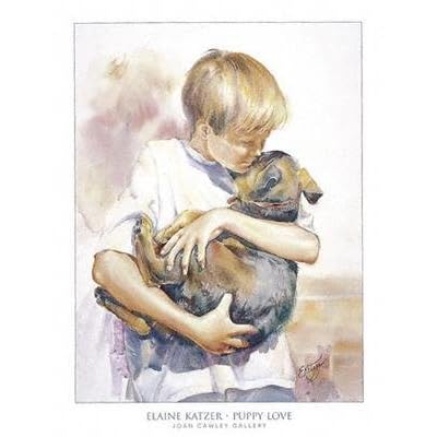 Boy holding puppy in arms