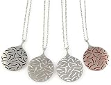 Ion Necklace, available in 4 colors. Featured here from left - right: black, clear, white and red.