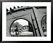 A Cyclist Passes a Draw Bridge as Snow Covers the City Center of Amsterdam Associated Press Collection Framed Art Poster Print, 31x25