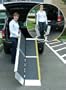 Wheelchair Ramp - 8' L x 29" W. Made in USA. This Trifold Advantage Series Ramp fits to steps, vehicles and raised landings for wheelchairs or scooters. Bottom transition plate "floats" to self-adjust. This ramp separates into two lightweight sections for easier handling. Unique 3-fold design features dual handles with slim profile