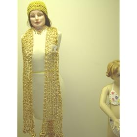 Click here to buy S107, Hand Crocheted Metallic Gold Gimp Scarf Measuring 12 Inch By 92 Inch with Matching Skull Cap... by Gita.
