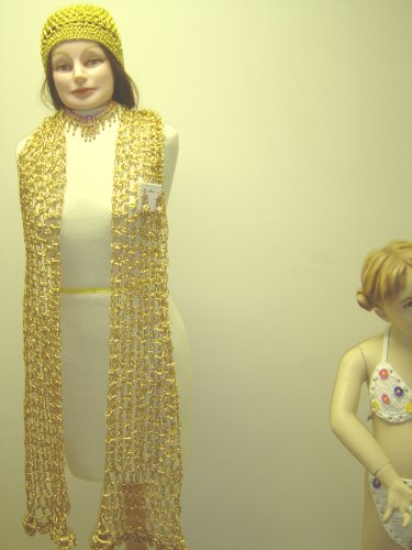 Click here to buy S107, Hand Crocheted Metallic Gold Gimp Scarf Measuring 12 Inch By 92 Inch with Matching Skull Cap....