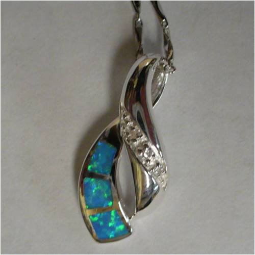 Click here to buy Swirl Kalifano Opal Necklace Pendant with Sterling Silver Chain by Al Zuni Global Jewelry.