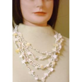 Click here to buy Imported Ivory Pearl and Seashell Long Chain Necklace and Matching Earrings for Women and Teens by Gita.