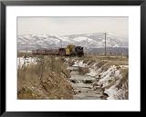 A Train Follows Alongside a River Framed Art Poster Print by Taylor S. Kennedy, 31x25