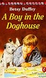 A boy in the doghouse
