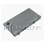 Rectangular battery with eight slit-type contacts on top. It has a step leg and fuel gage on back.