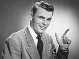 IMAGE OF Young Man Pointing in Studio Photographic Poster Print by George Marks, 12x16