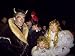 People Dressed up as the Devil and Two Angels in the Old Town on Eve of St. Nicholas Day Photographic Poster Print by Richard Nebesky, 30x40