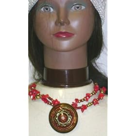 Click here to buy Antique Gold Plated Round and Other Beads Ethnic Icon Collection Necklace with Pendant and Earrings by Gita.