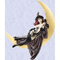 medieval witch statue in gothic crescent moon sculpture