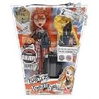 Bratz Pretty N' Punk Destination 2 World London 10 Inch Doll - Meygan with 2 Punk Party Outfits, Travel Suitcase with Stickers, Yellow Trench Coat, Star-Shaped Hairbrush Plus Exclusive Punk Pet Gavin and Collectible Poster